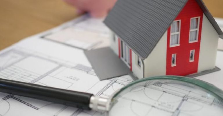 house and magnifying glass