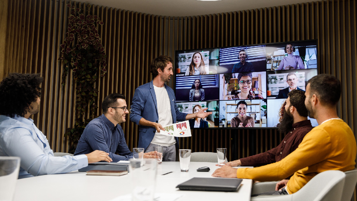 work meeting with hybrid colleagues in digital workplace