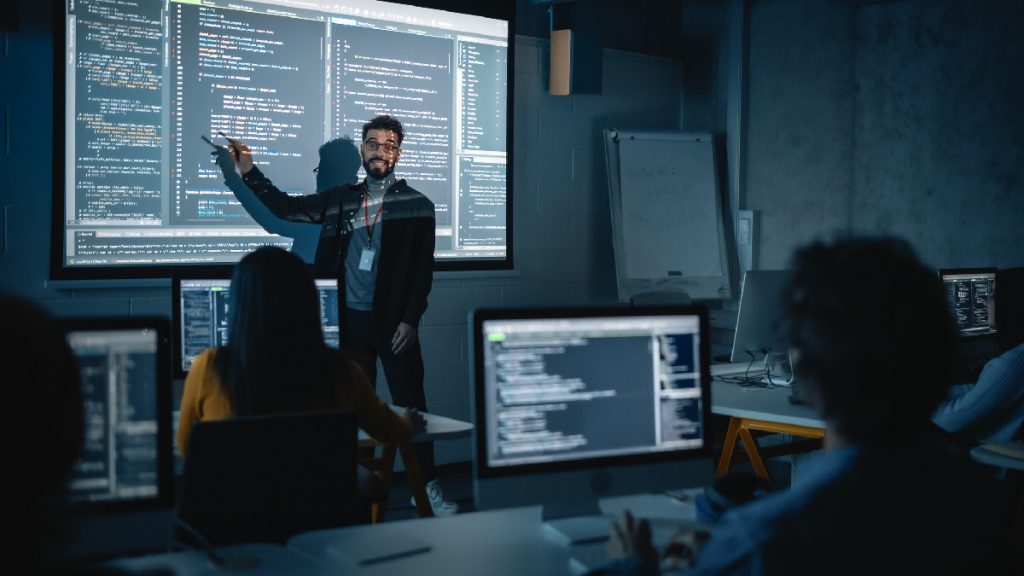 teacher teaches class about computer science