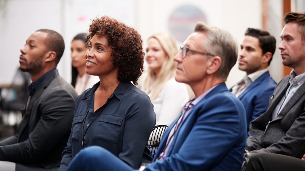 People at an event looking engaged